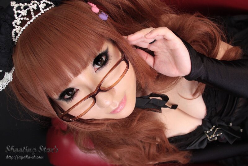 woman with glasses and tiara