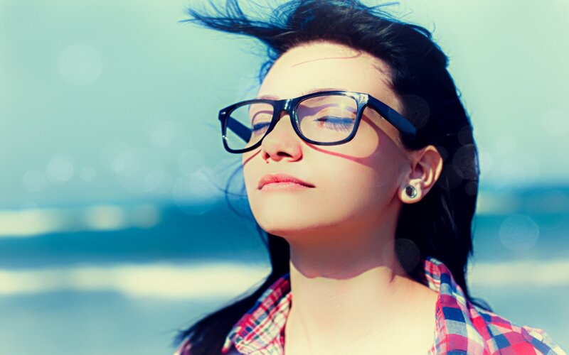woman with glasses at beach