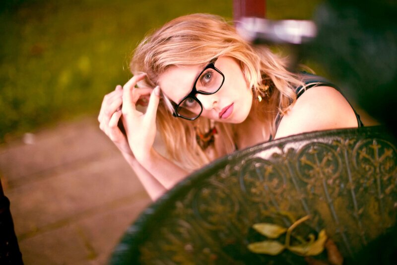 woman with glasses in park