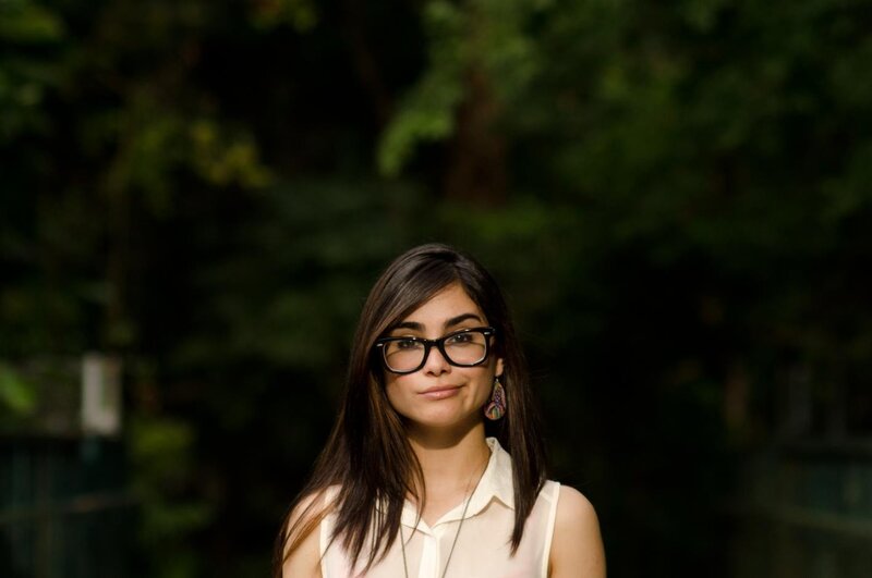 woman with glasses in park