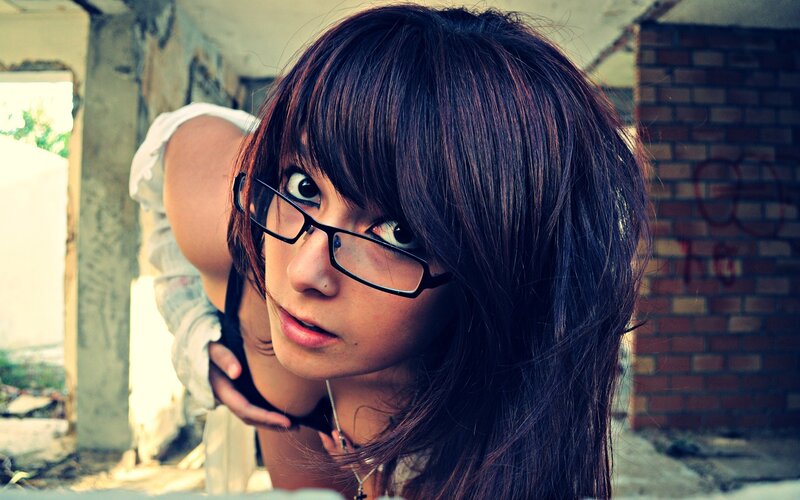 woman with glasses in urban setting