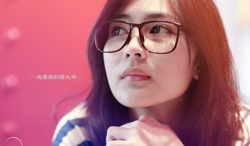 woman with glasses looking up