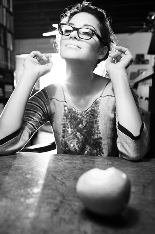 woman with glasses looking up