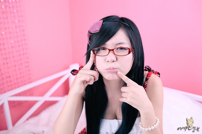 woman with glasses making a face