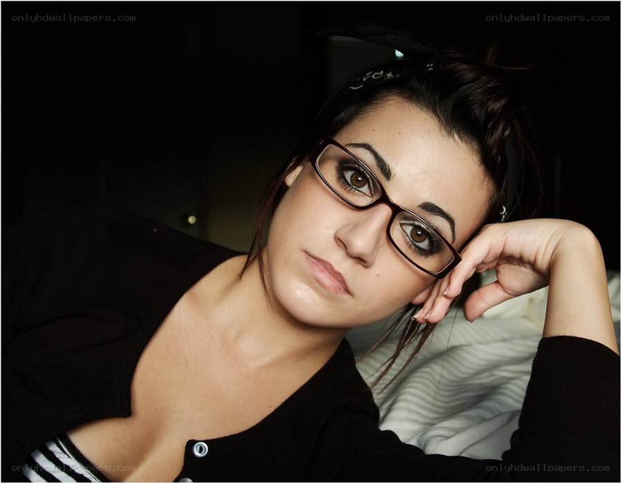 woman with glasses posing