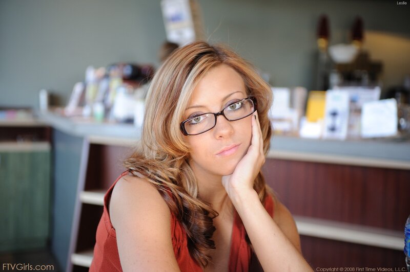 woman with glasses resting hand