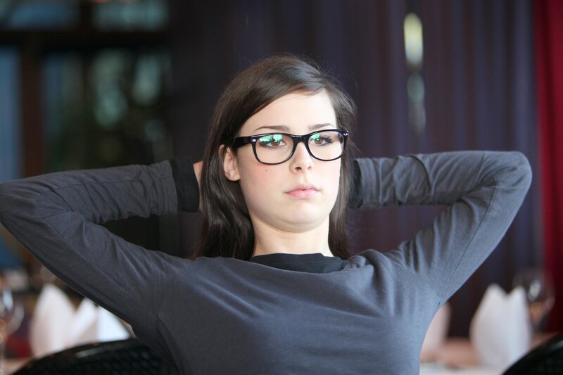 woman with glasses resting