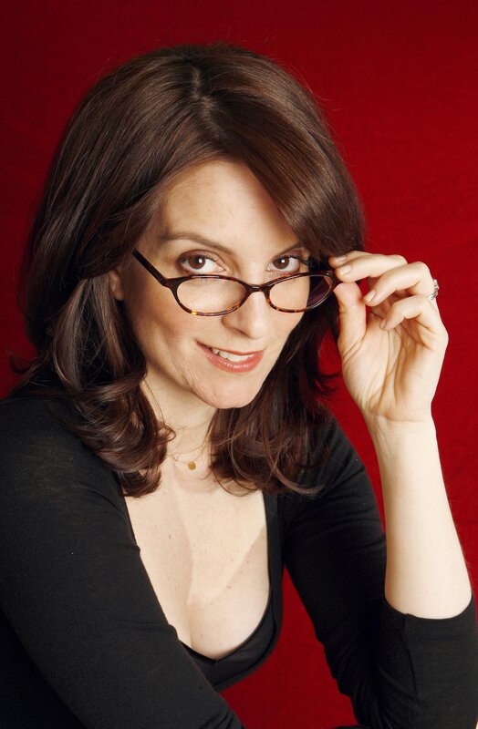 woman with glasses smiling