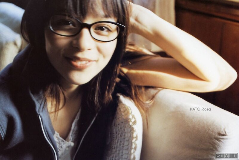 woman with glasses smiling