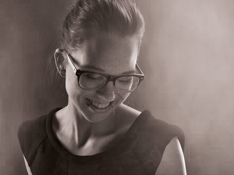 Woman with Glasses Smiling — Gray