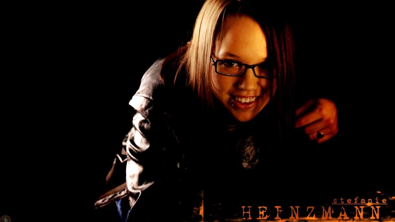 woman with glasses smiling