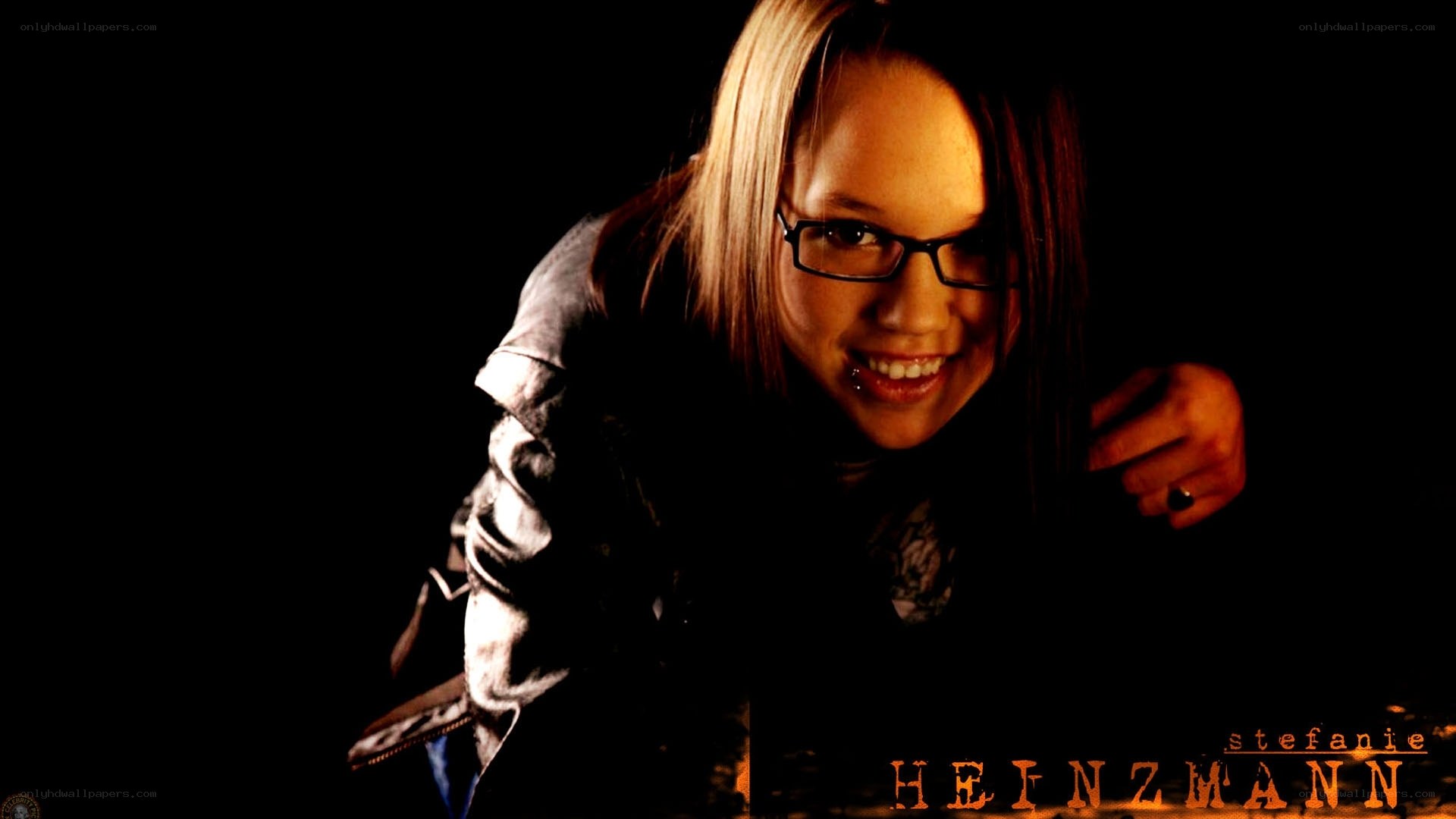 woman with glasses smiling