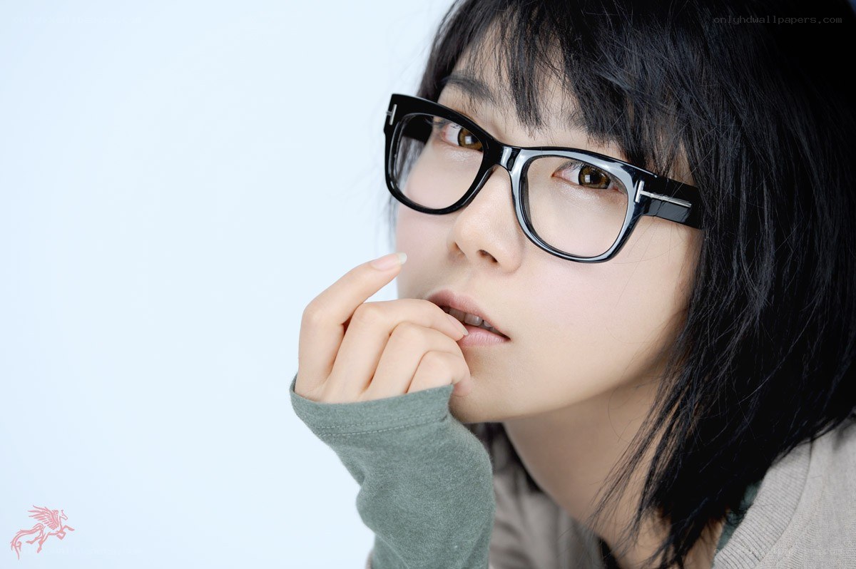woman with glasses thinking