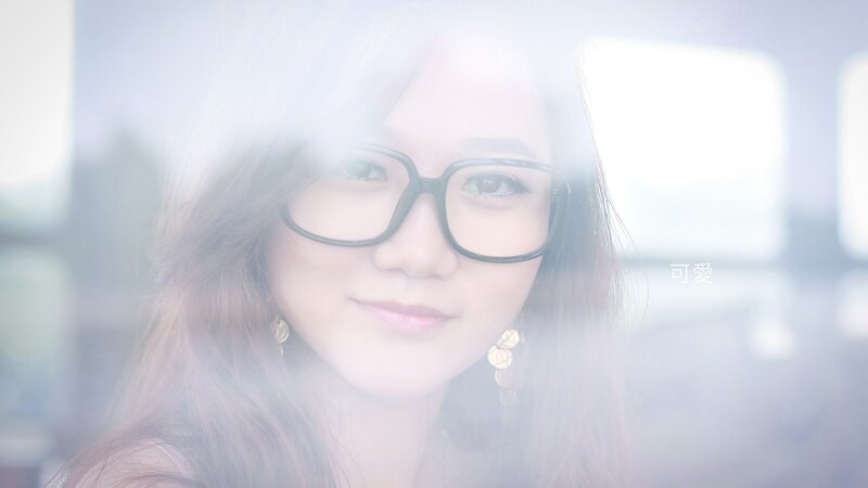 woman with glasses through glass