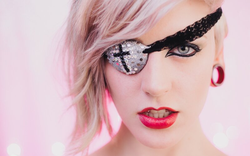 woman with glitter eye patch