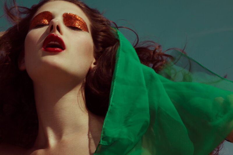 woman with glitter eyes and red lips