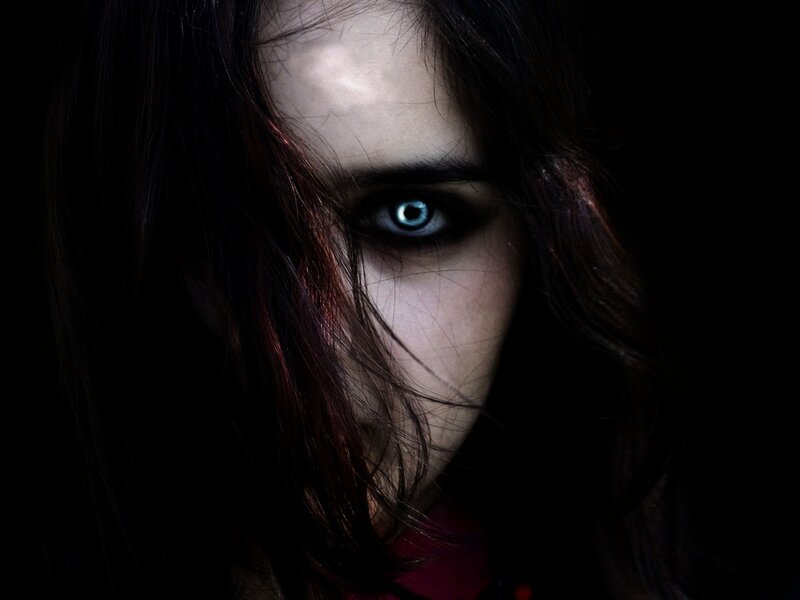 woman with glowing blue eye