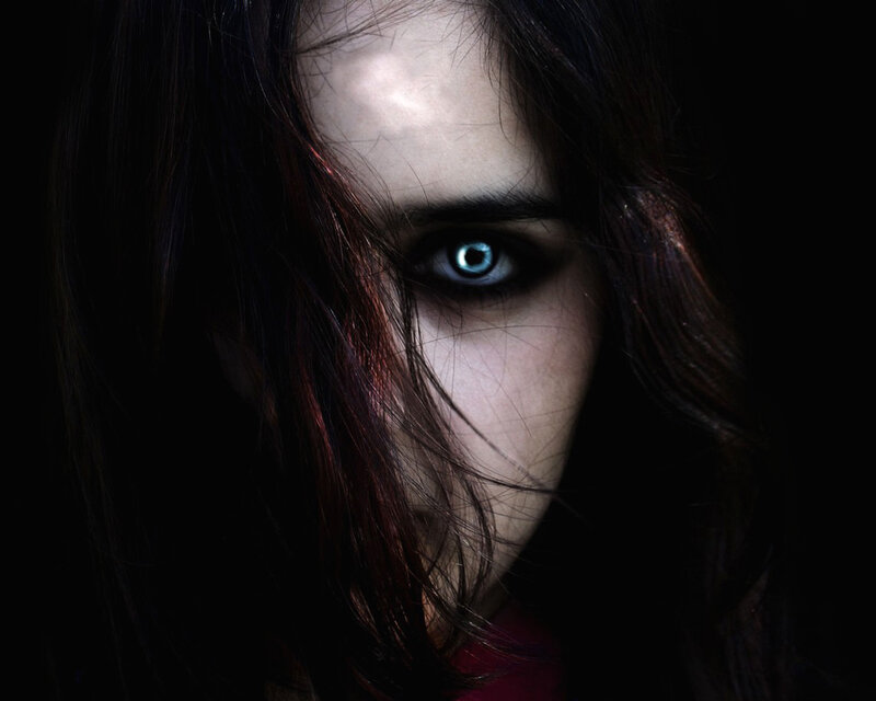 woman with glowing blue eye