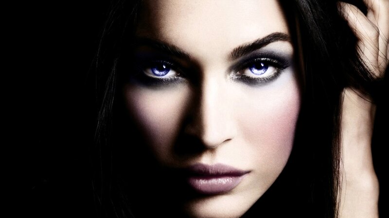 woman with glowing blue eyes