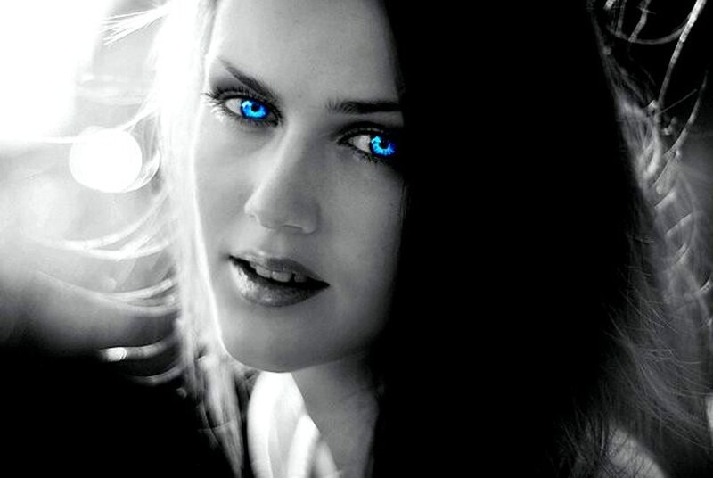 woman with glowing blue eyes