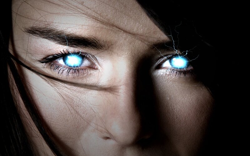 woman with glowing blue eyes