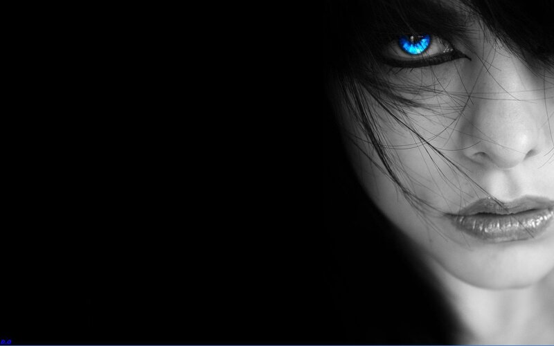 woman with glowing blue eyes