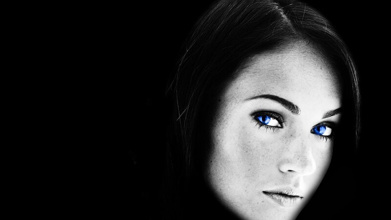 woman with glowing blue eyes