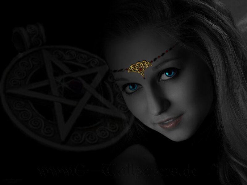 woman with glowing eyes and pentagram