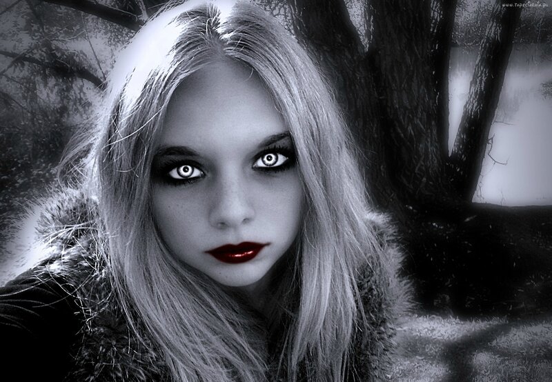 woman with glowing eyes in forest