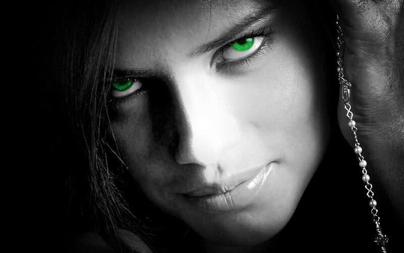 woman with glowing green eyes