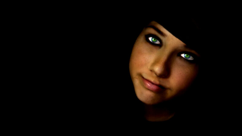 woman with glowing green eyes