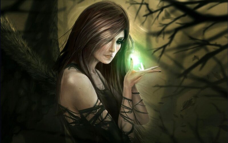 woman with glowing hand in forest