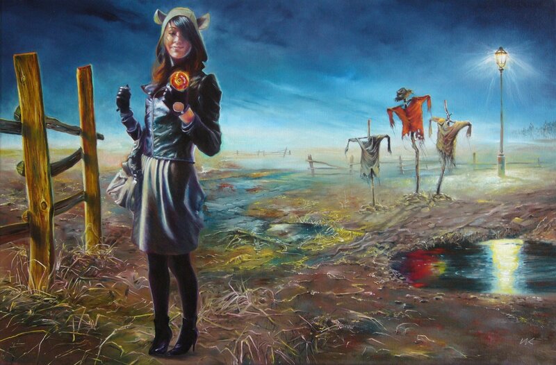 Woman with glowing orb in a field