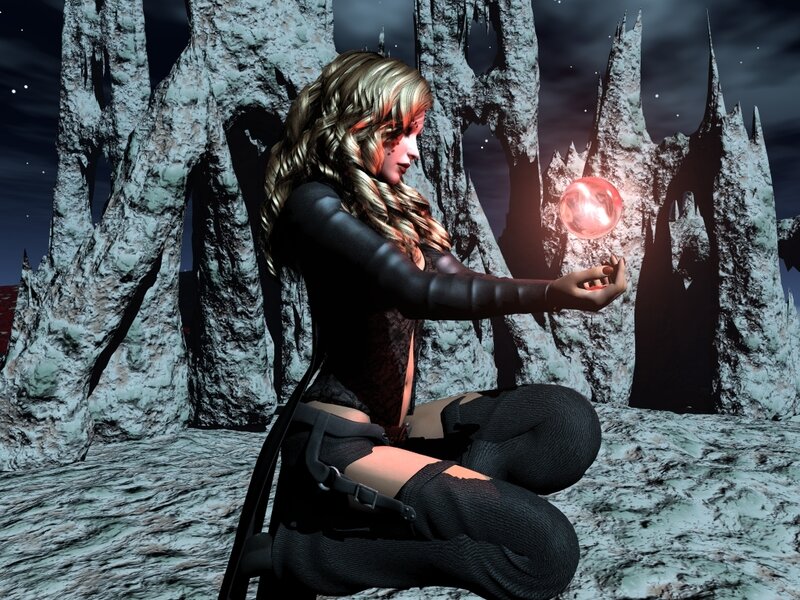 woman with glowing orb in cave