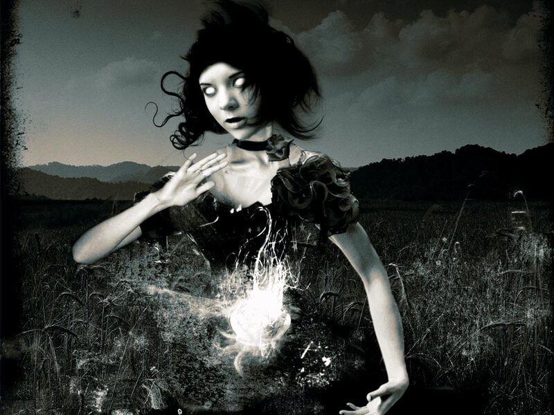 woman with glowing orb in field