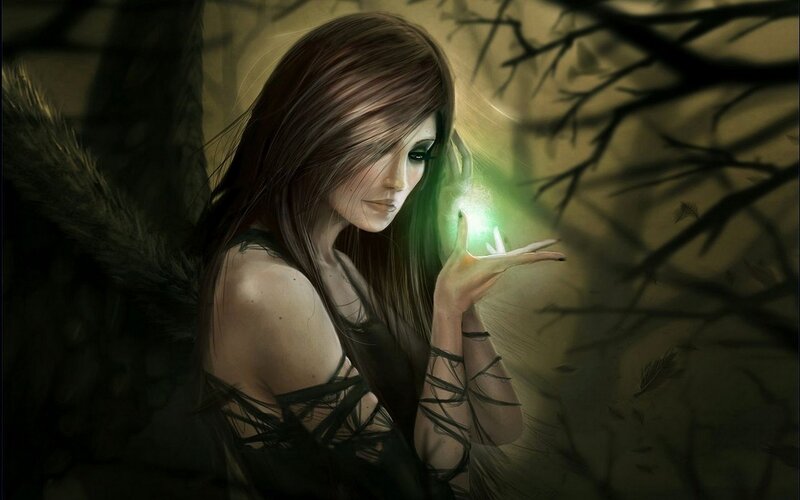 woman with glowing orb in forest