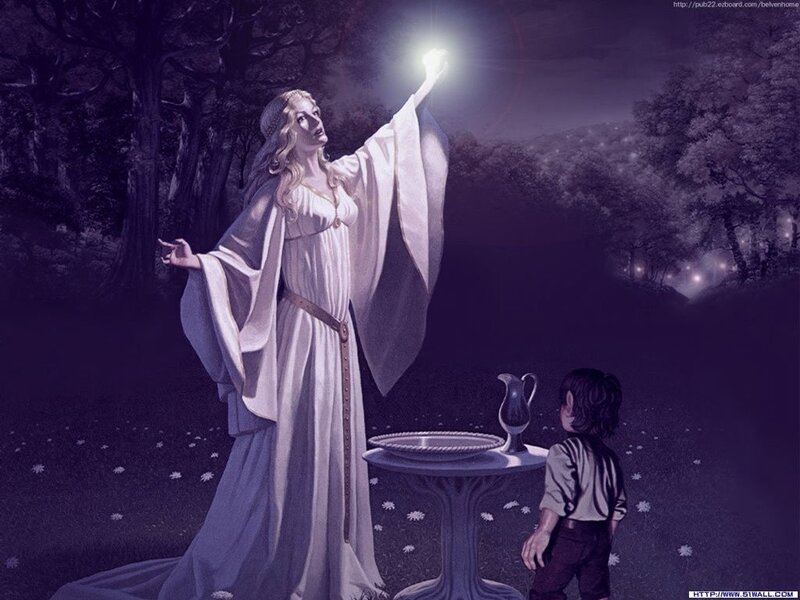 Woman with glowing orb in forest