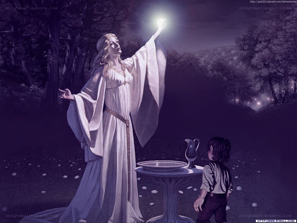 Woman with glowing orb in forest