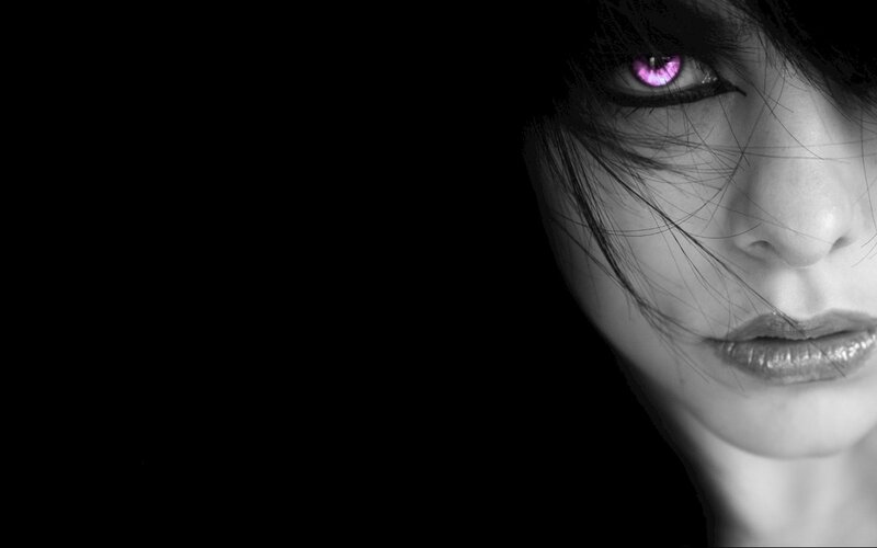 woman with glowing purple eyes