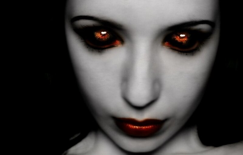 woman with glowing red eyes