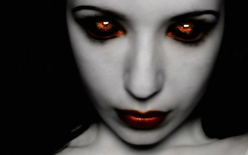 woman with glowing red eyes