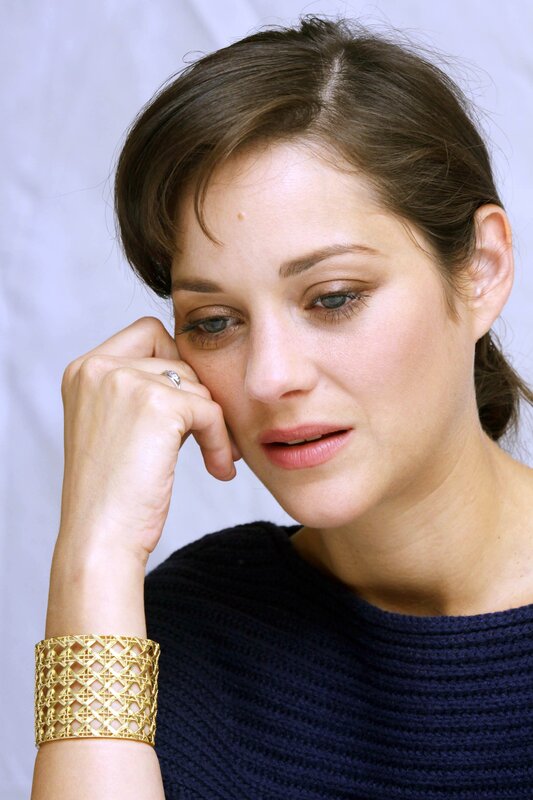 woman with gold bracelet