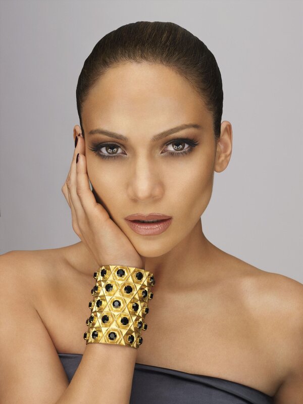 woman with gold bracelet