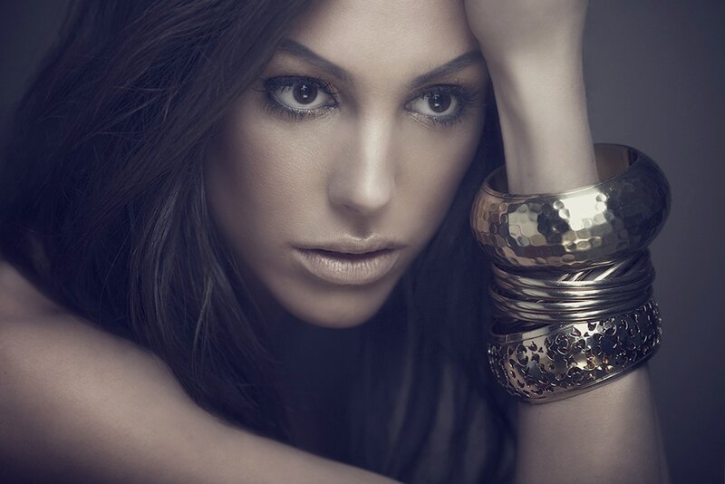 woman with gold bracelets