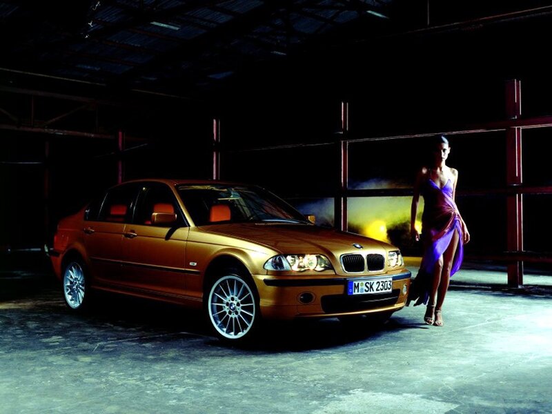 woman with gold car in warehouse
