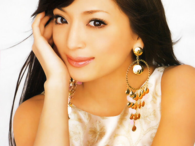 woman with gold earrings