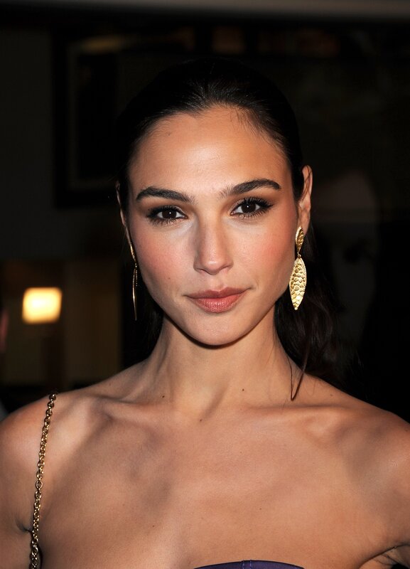 woman with gold earrings
