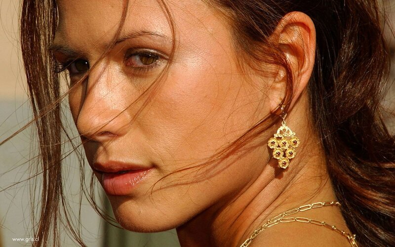 woman with gold earrings