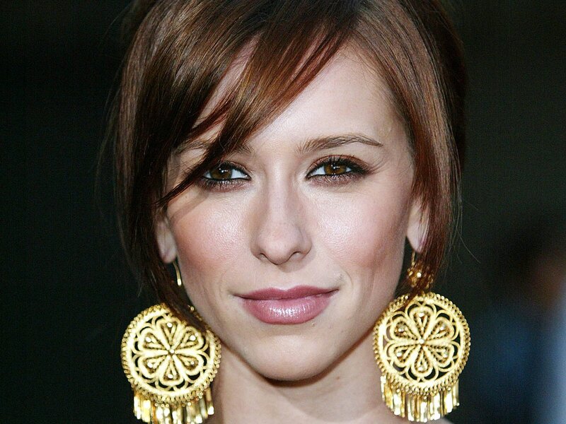 woman with gold earrings