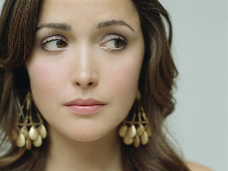 woman with gold earrings